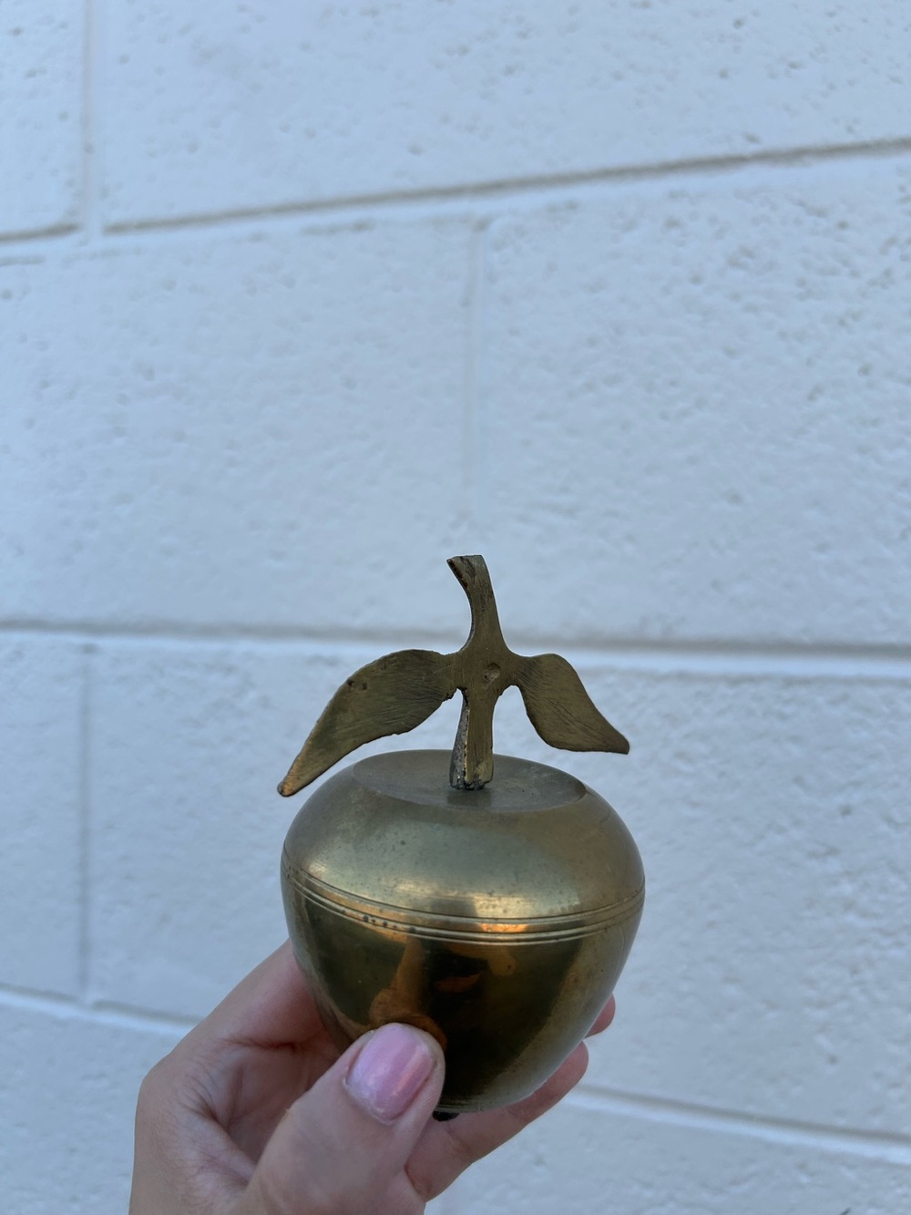 vintage solid brass apple-shaped bell featuring an attached stem and leaf handle